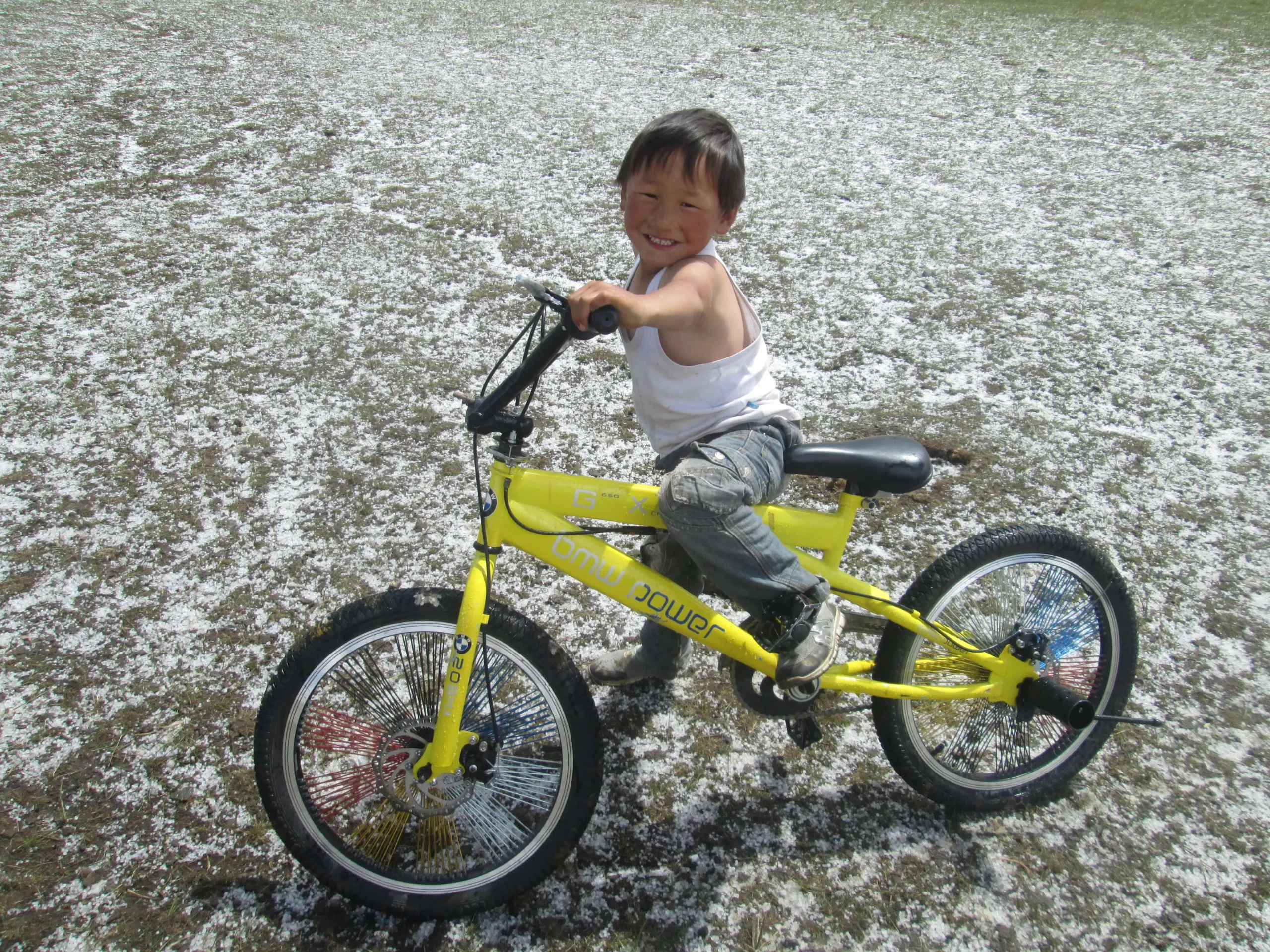 Cycler Mongolian boy
